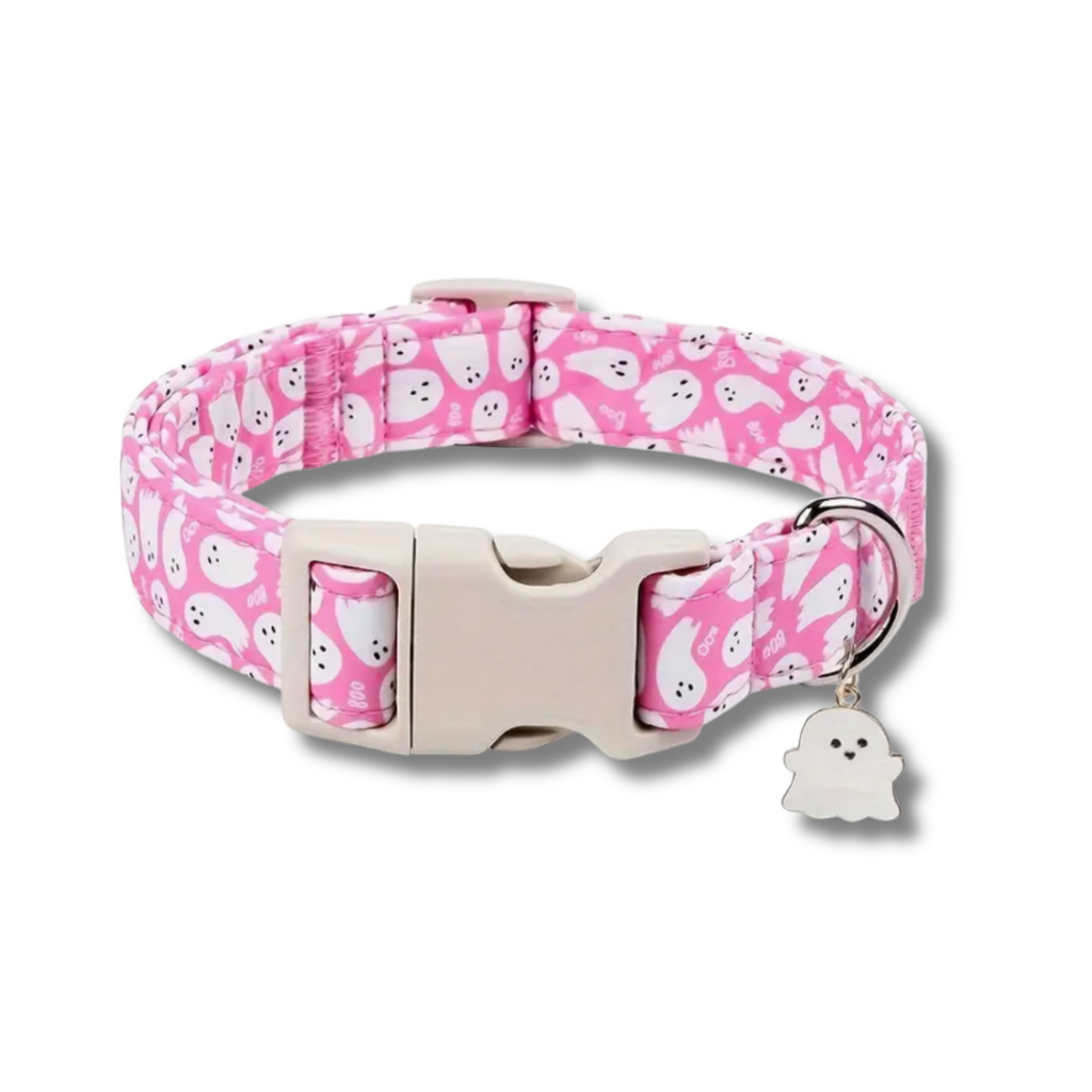 Pink dog collar with ghost pattern and detachable tag on a white background