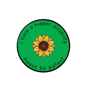 Circular sticker with sunflower and text 'I have a hidden disability, please be patient' on a green background