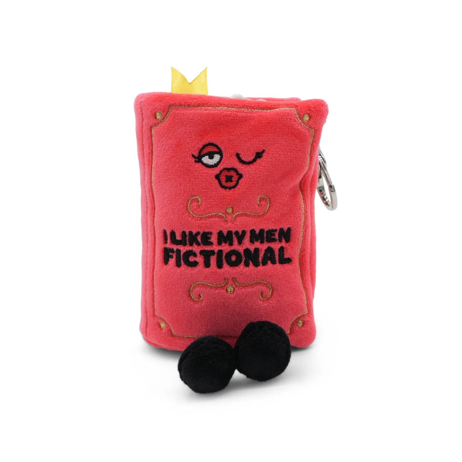 Red plush book-shaped toy with face and text on a white background