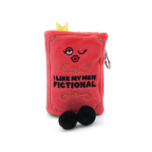 Red plush book-shaped toy with face and text on a white background