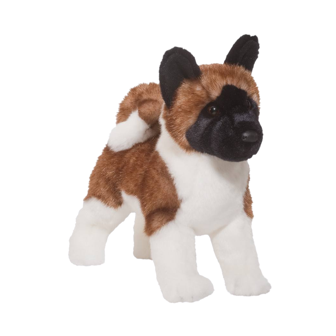 Plush toy of a dog with brown, black, and white fur on a white background