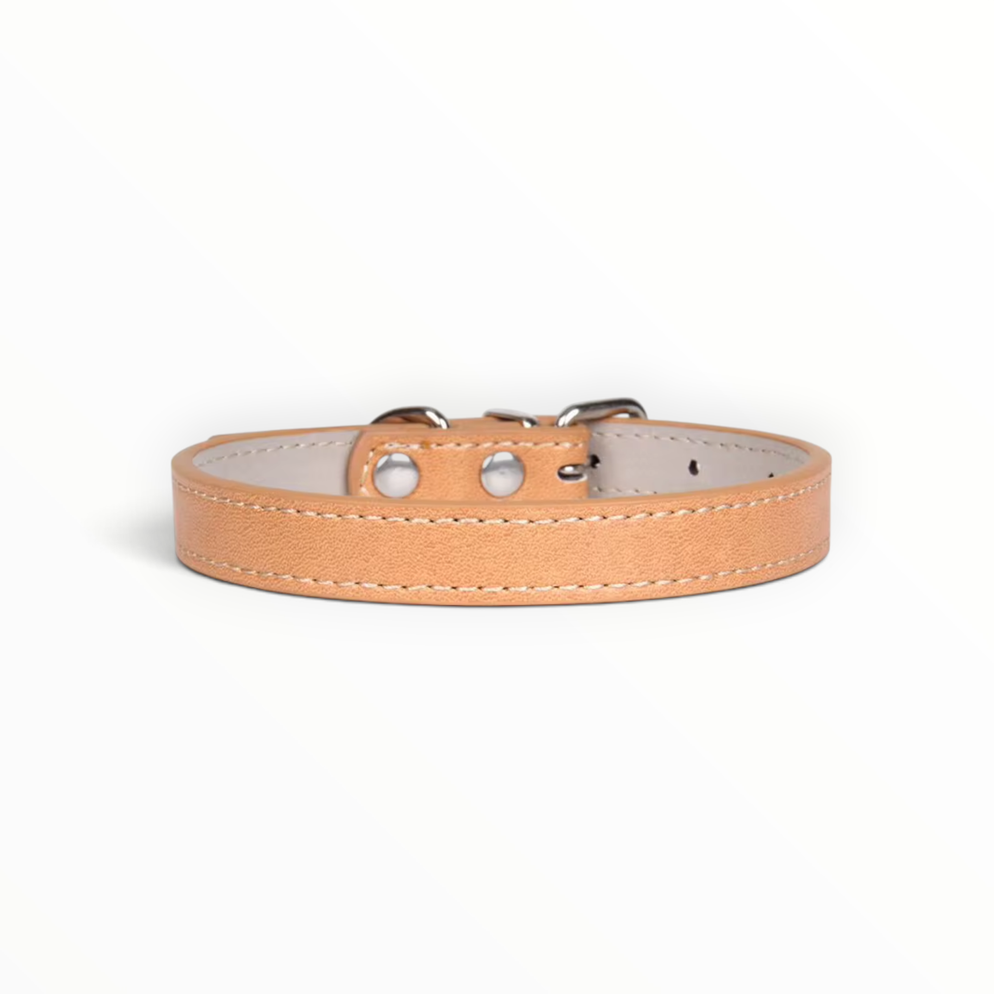 A light tan leather dog collar with silver metal hardware and white stitching, shown against a plain white background.