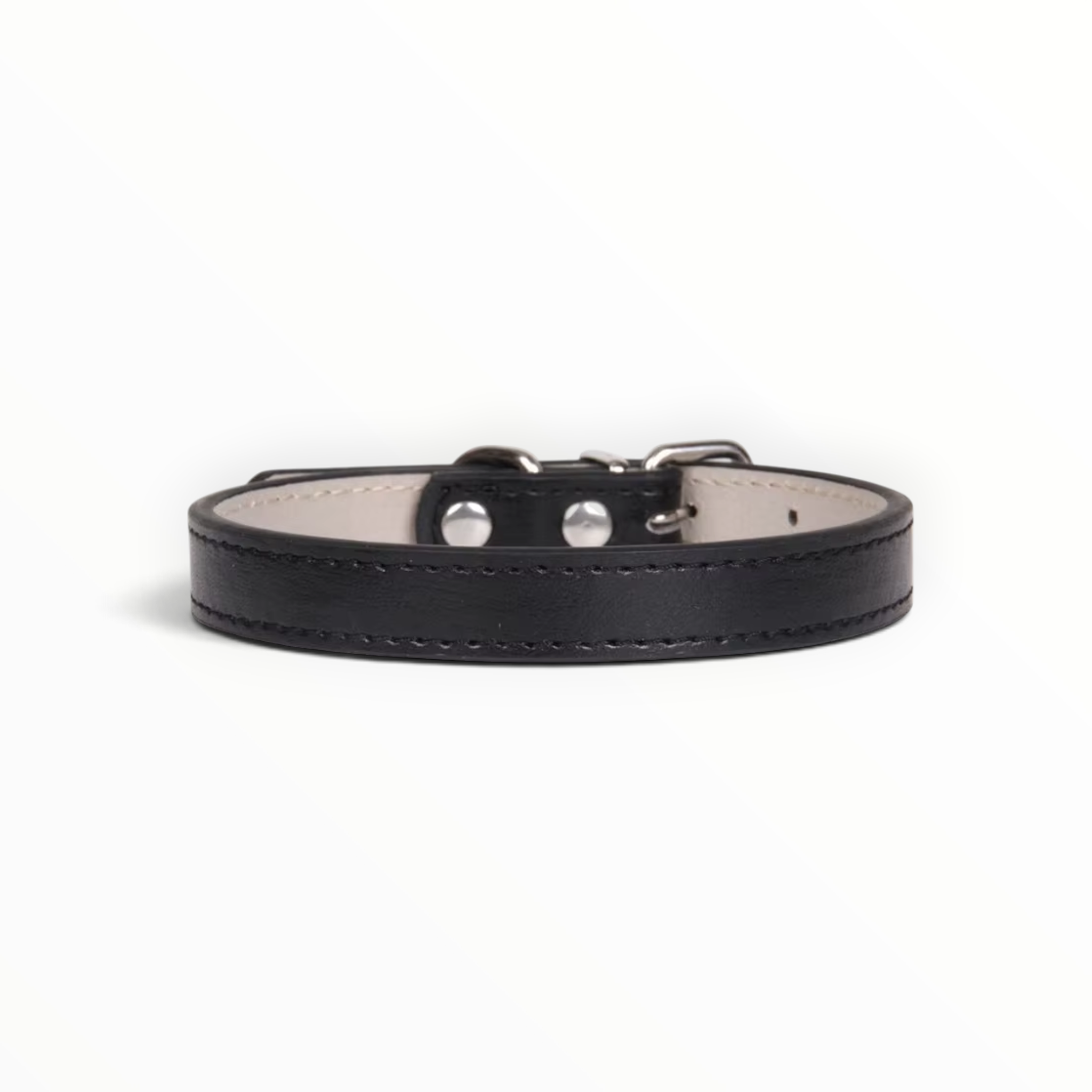 A black leather collar with silver-tone metal hardware and a light beige interior lining, shown against a plain white background.