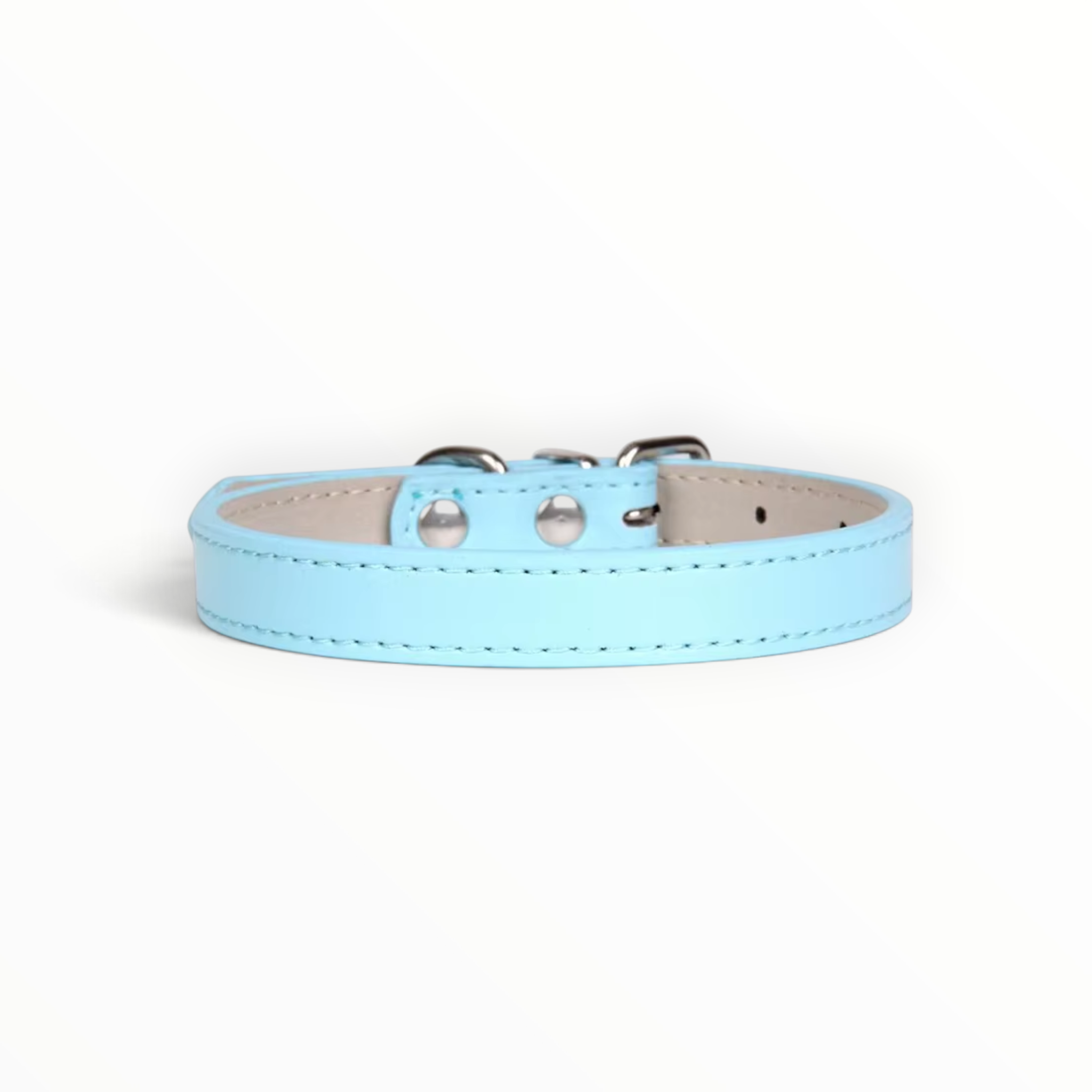 A light blue faux leather dog collar with silver metal hardware, displayed on a clean white background.