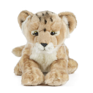 Plush toy lion lying down on a white background