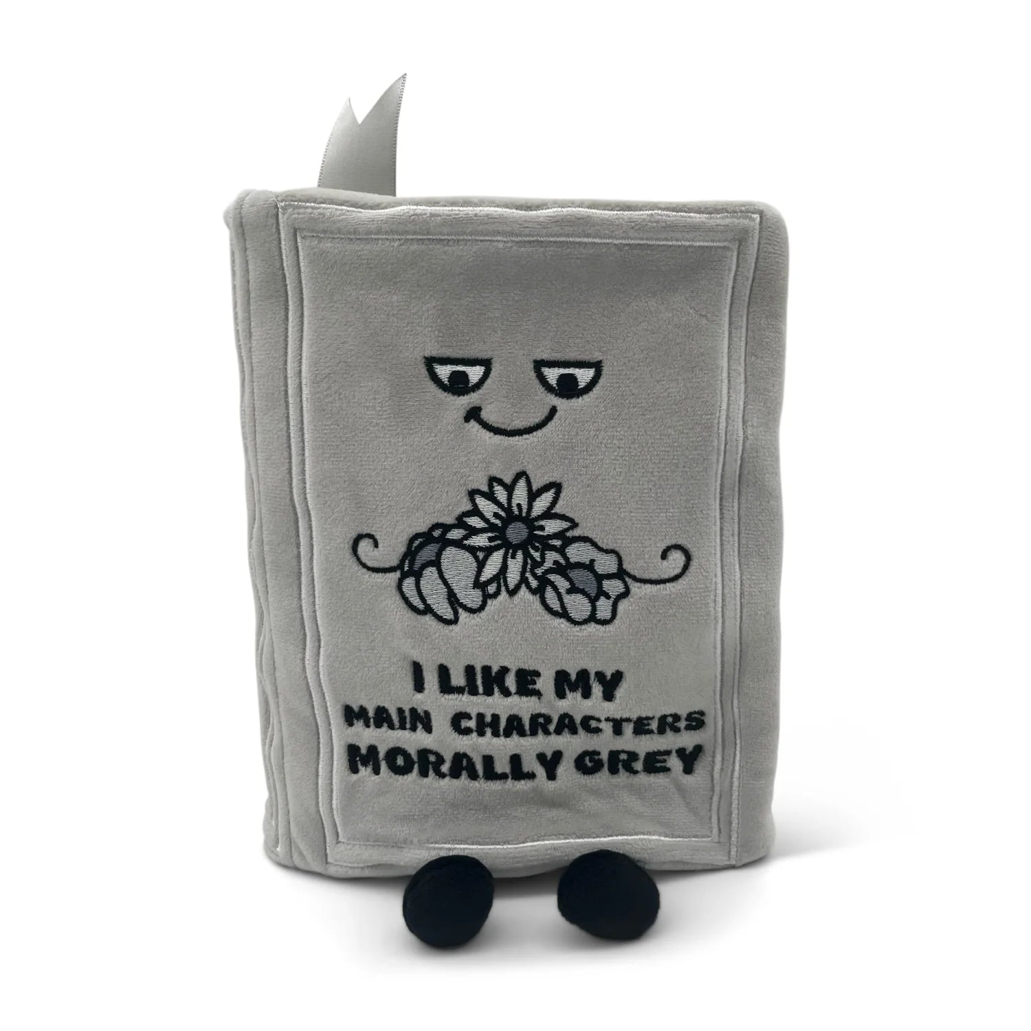 Gray plush toy with a face and text on a white background