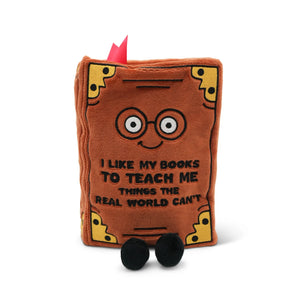 Plush book-shaped toy with wheels and a quote on a white background