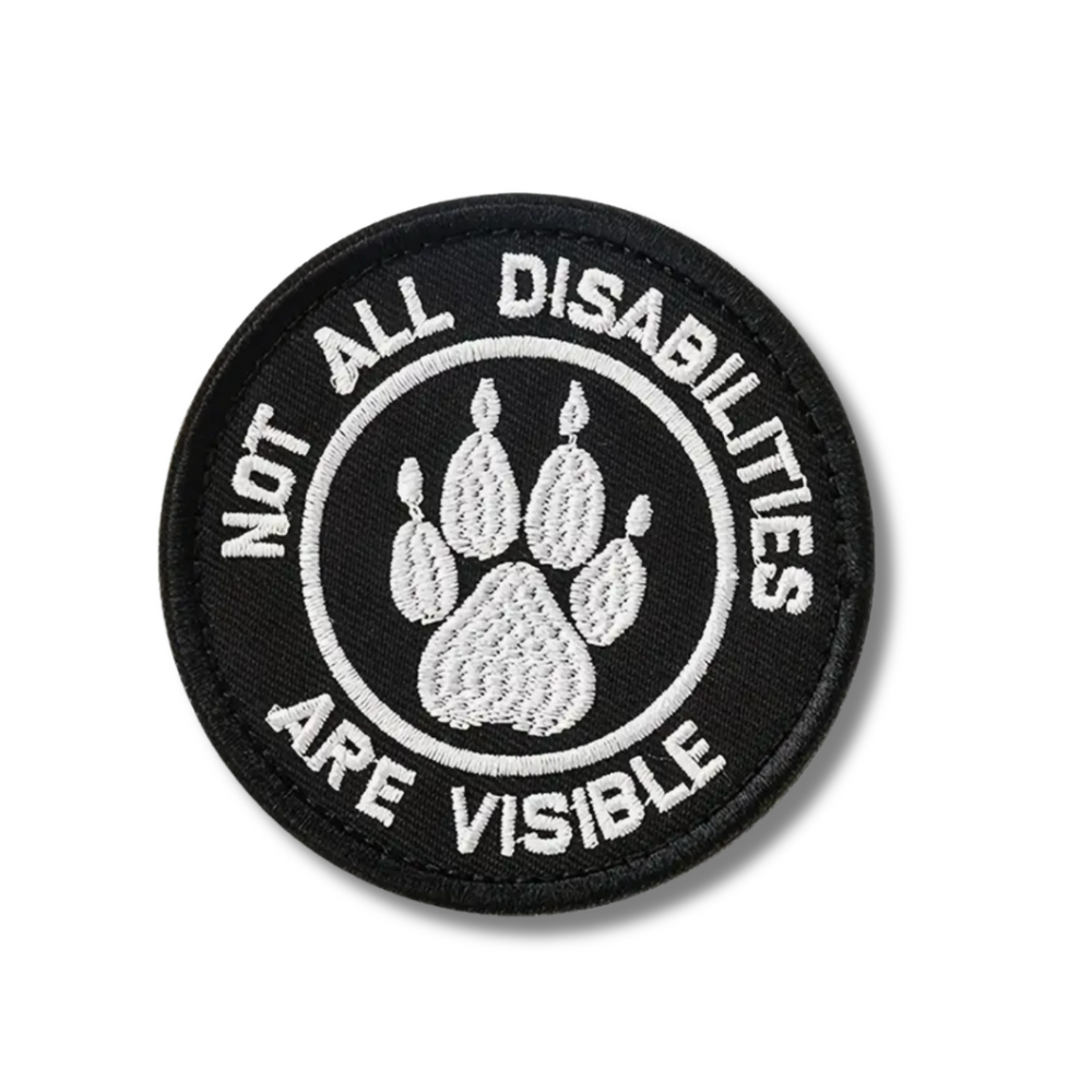 Patch with paw print and text 'Not all disabilities are visible' on a white background