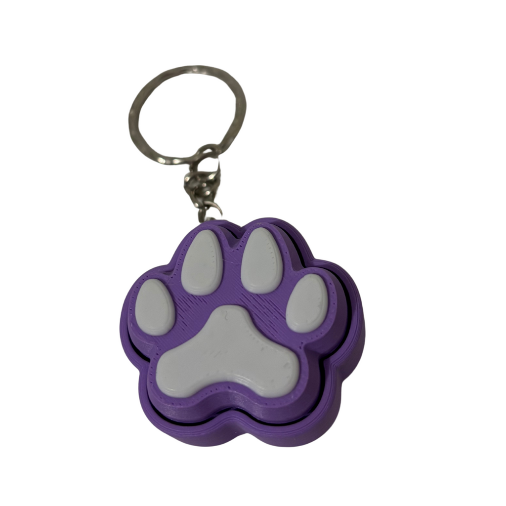 Purple paw-shaped keychain on a white background