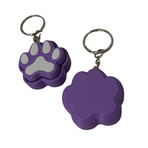 Two purple paw-shaped keychains on a white background