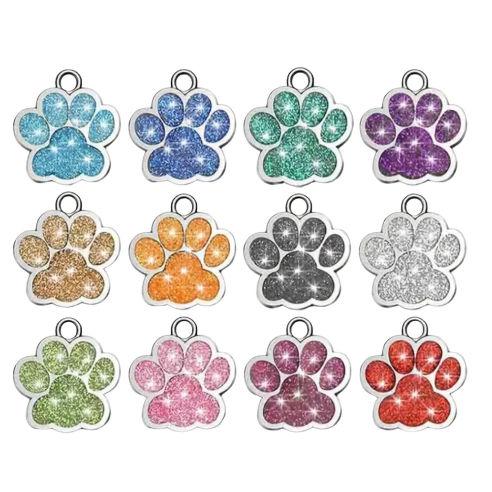 Set of colorful glittery paw print charms on a white background