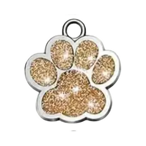 Paw print charm with gold glitter on a white background