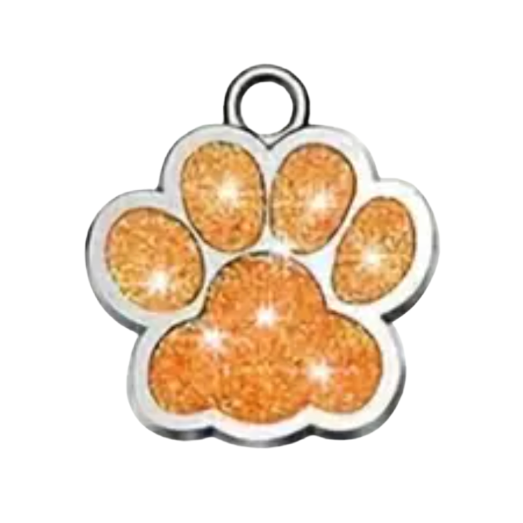 Paw print charm with orange glitter on a white background