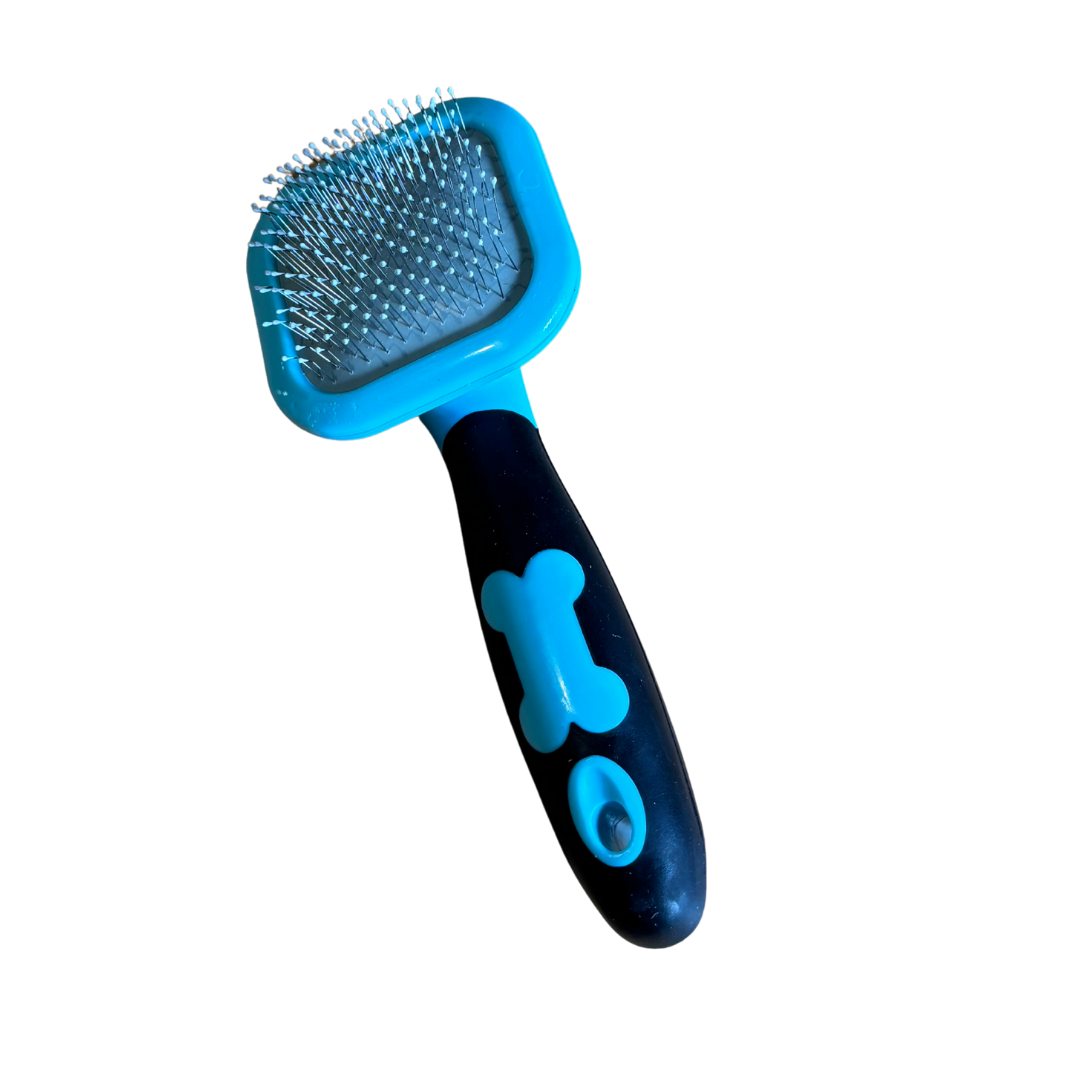 Blue and black pet grooming brush with a bone design on a white background