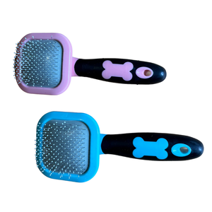 Two pet grooming brushes with pink and blue handles on a white background