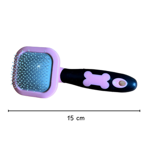 Pet grooming brush with a bone design on a white background