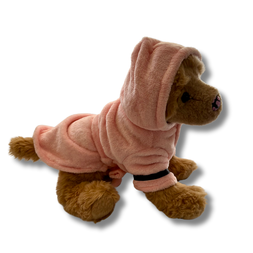 Plush dog wearing pink bathrobe.