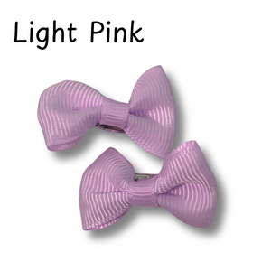 Two light pink hair bows on a white background with 'Light Pink' text above.