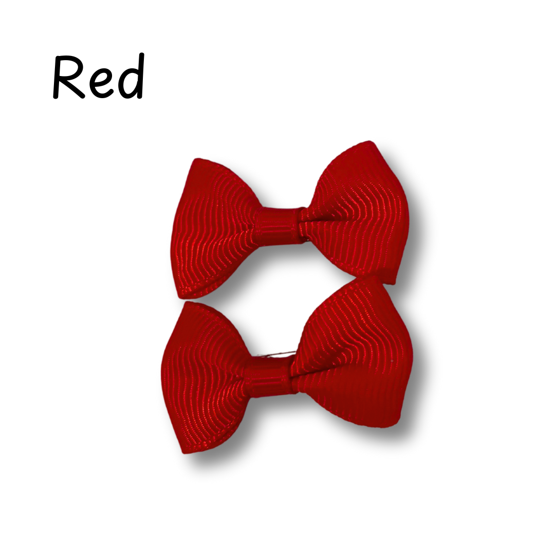 Two red hair bows on a white background with the word 'Red' above them.
