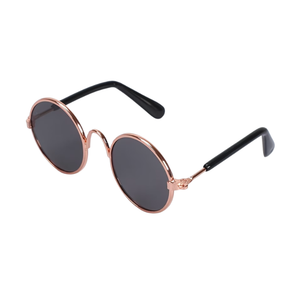 Sunglasses with rose gold frame and black lenses on a white background