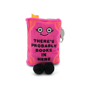 Pink plush toy book with a face and text on a white background