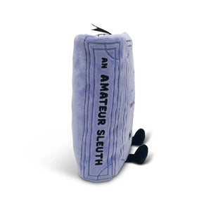 Plush toy shaped like a book titled 'An Amateur Sleuth' on a white background