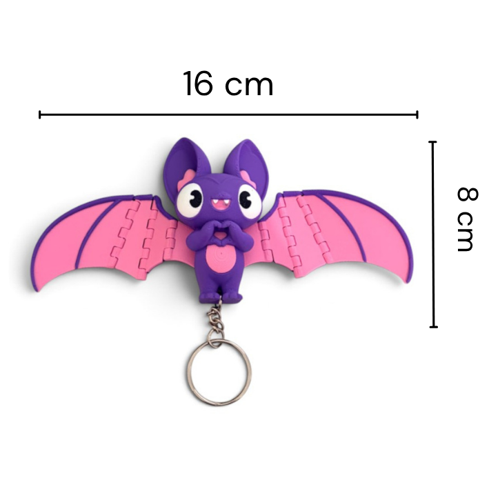A small bat-shaped keychain with pink wings and a purple body, shown on a white background with measurement lines indicating 16 cm width and 8 cm height.