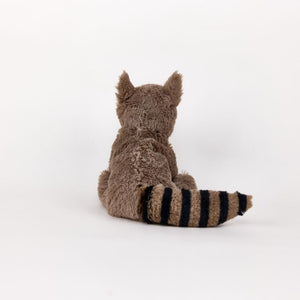 A plush toy raccoon shown from the back, featuring brown fur and a striped tail in brown and black, set against a plain white background.