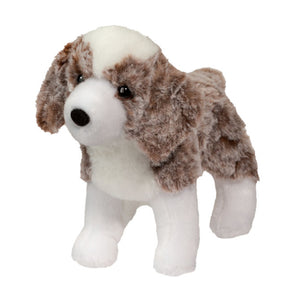 Plush dog toy with brown and white fur on a white background