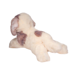 Plush toy resembling a dog with brown spots on a white background