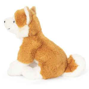 Plush toy dog with brown fur and white accents on a white background