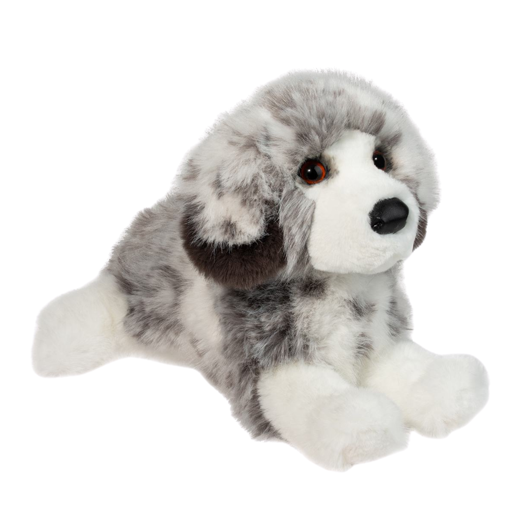 Plush toy dog with gray and white fur on a white background