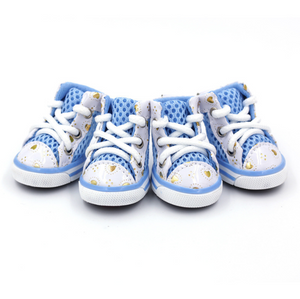 Three baby high-top sneakers in light blue and white with gold glitter accents, arranged on a plain white background.