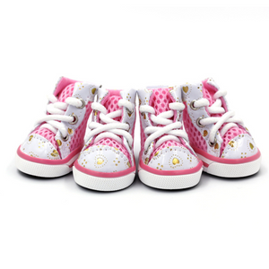 A pair of baby high-top sneakers in pink and white, featuring a polka-dot pattern, gold heart accents, and white laces, set against a plain white background.