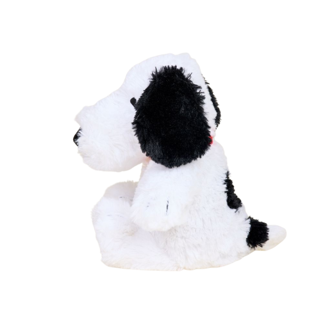 Plush toy dog with black spots on a white background