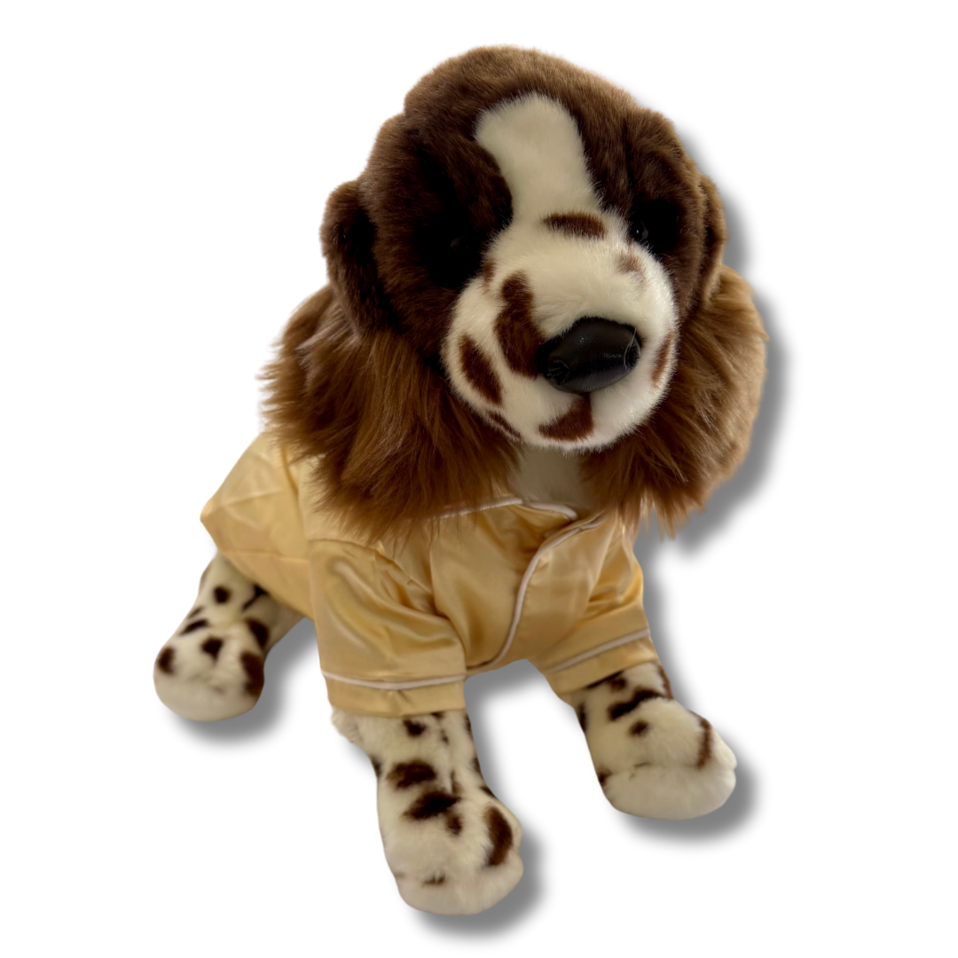 Springer Spaniel Plushie wearing yellow pyjamas front view