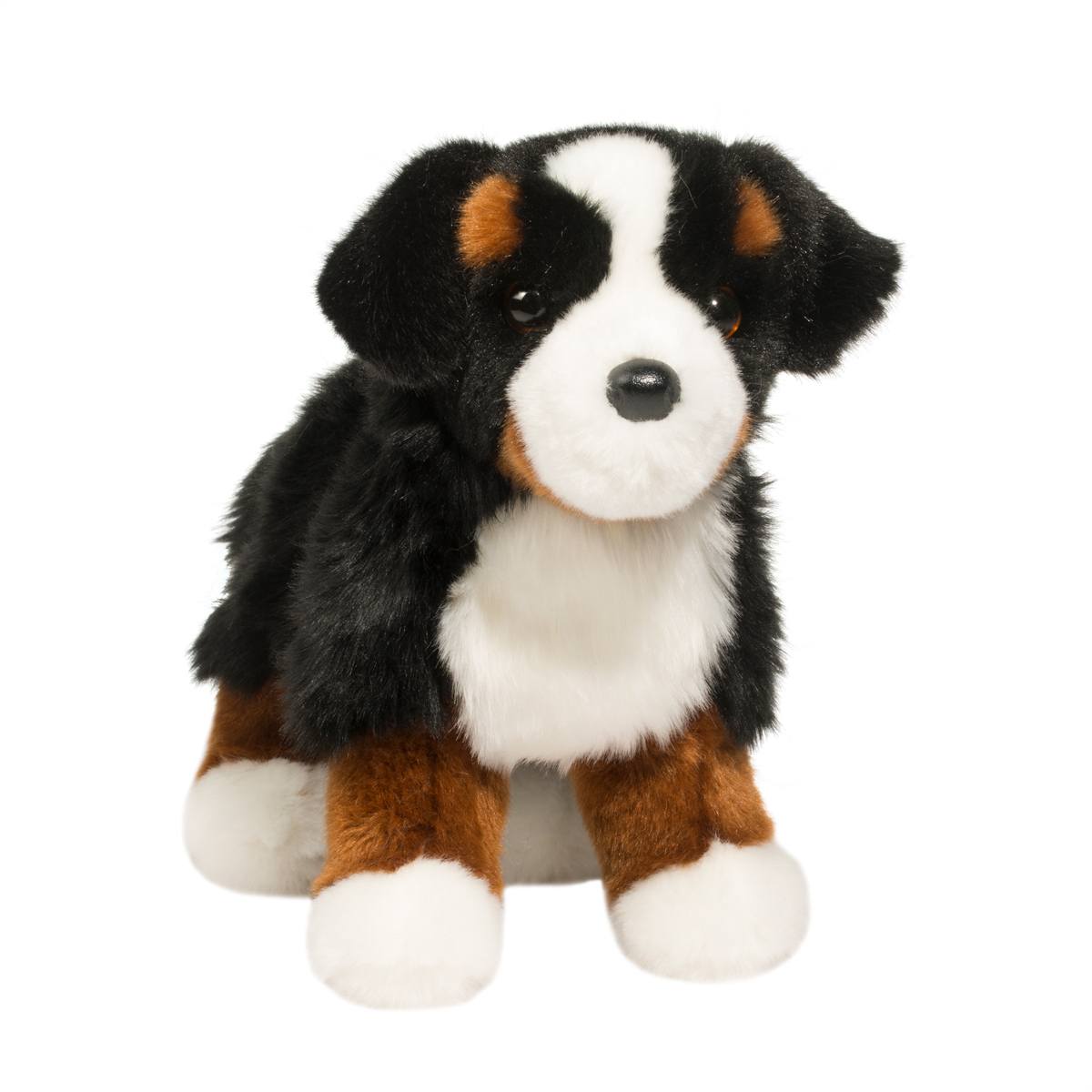 Plush toy dog with black, white, and brown fur on a white background
