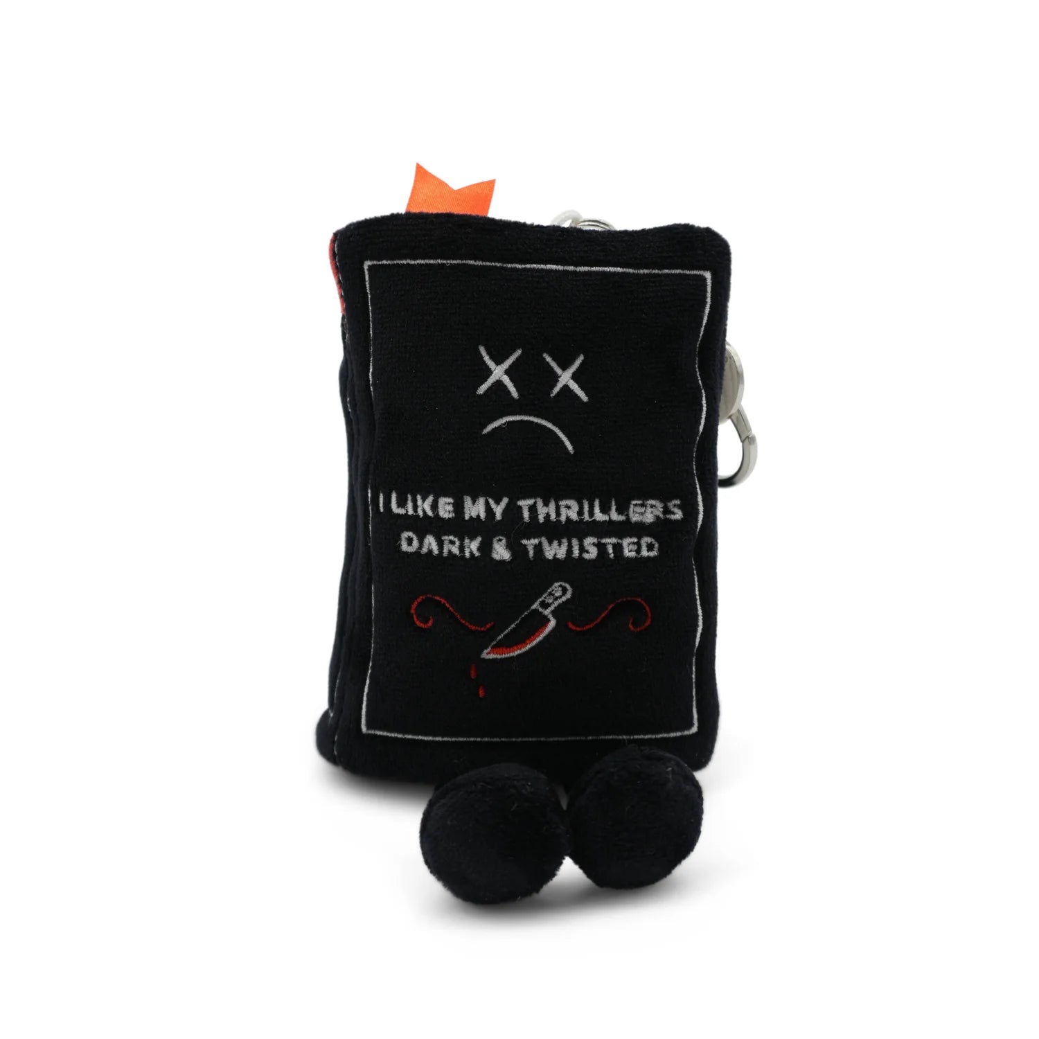 Black plush toy with a sad face and text on a white background