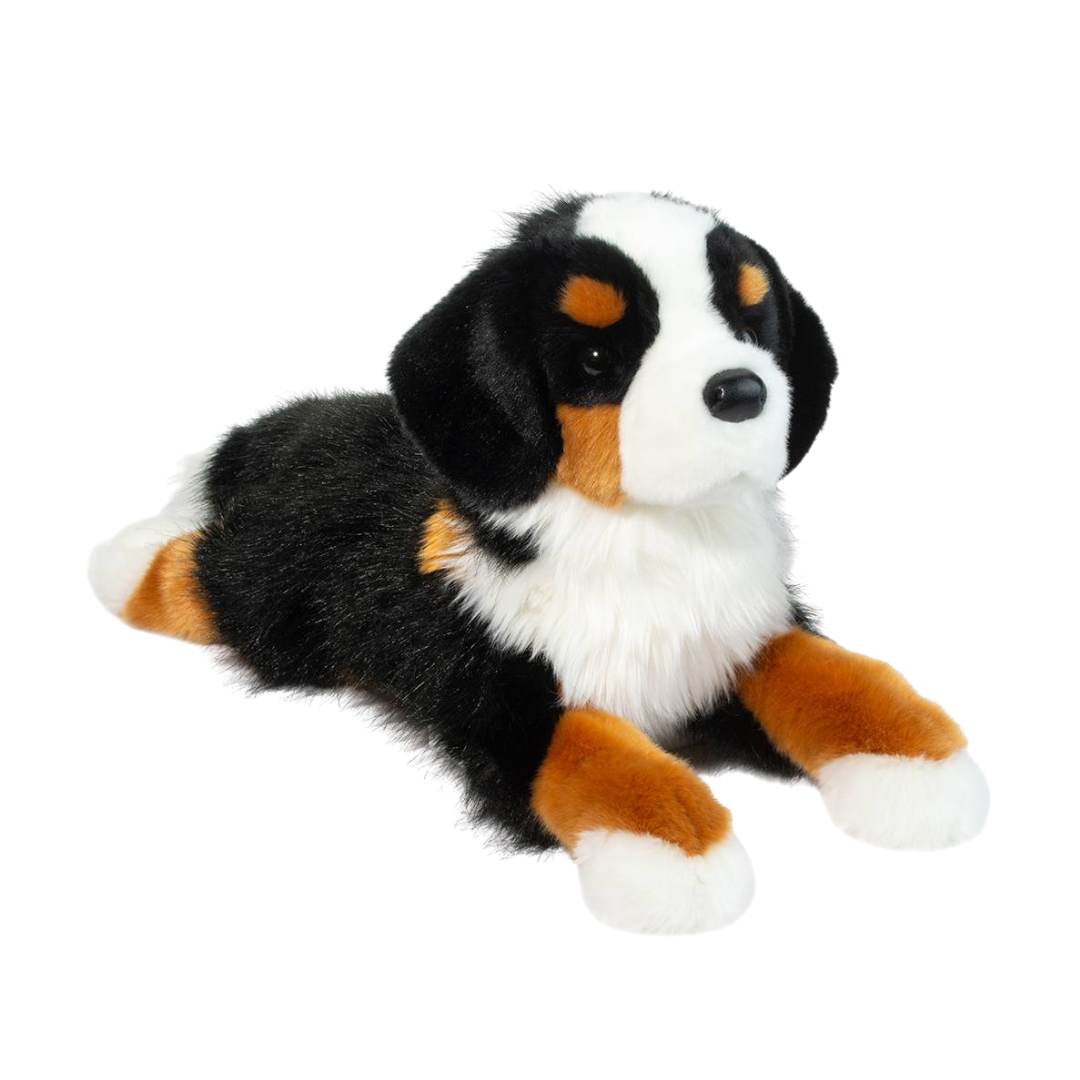 Plush toy of a dog with black, brown, and white fur on a white background