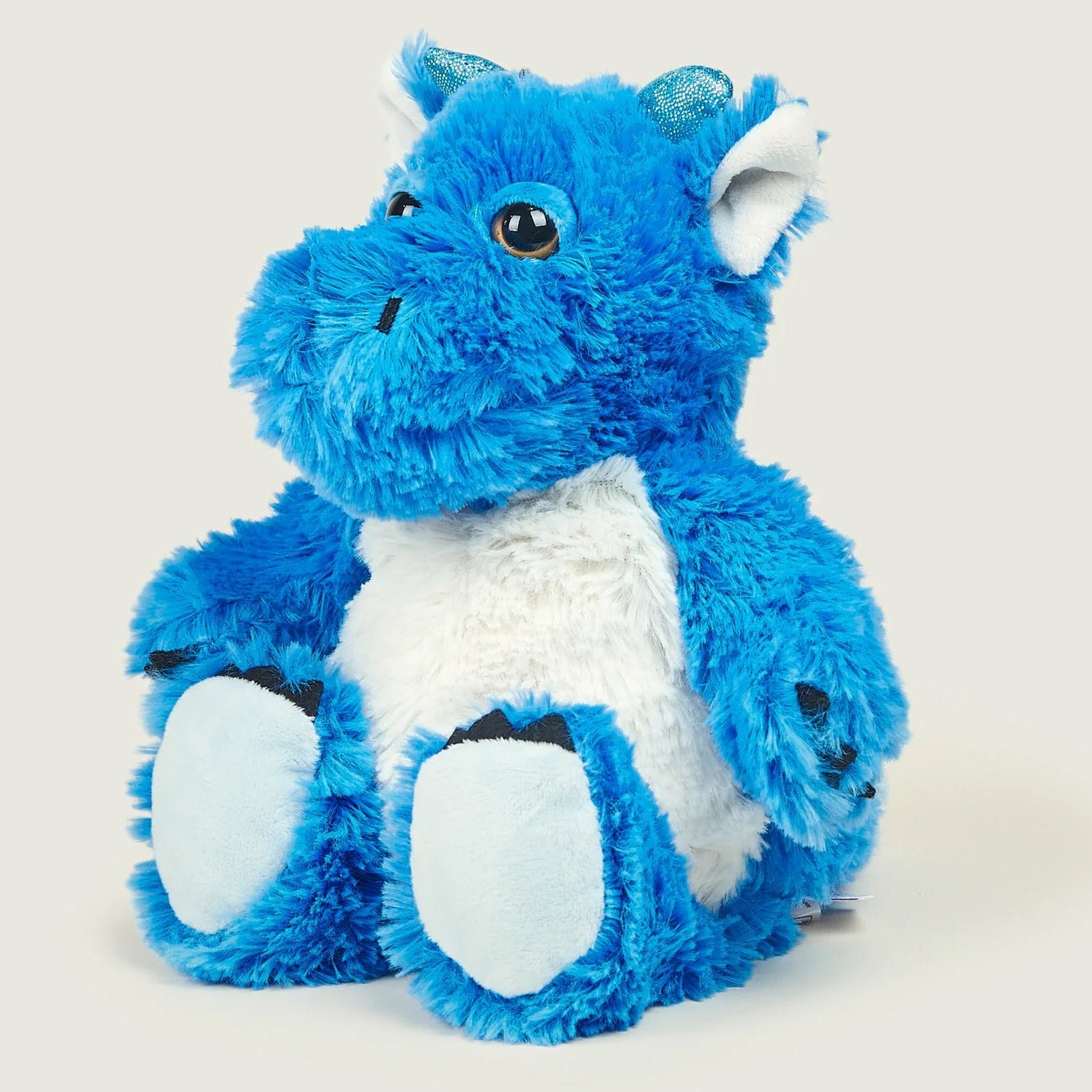 Blue plush dragon toy on a white background