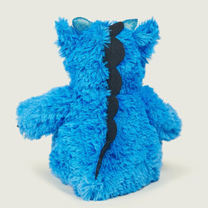 A bright blue fuzzy monster plush toy shown from the back, featuring a black stitched spine detail and small translucent blue ears, set against a solid light beige background.