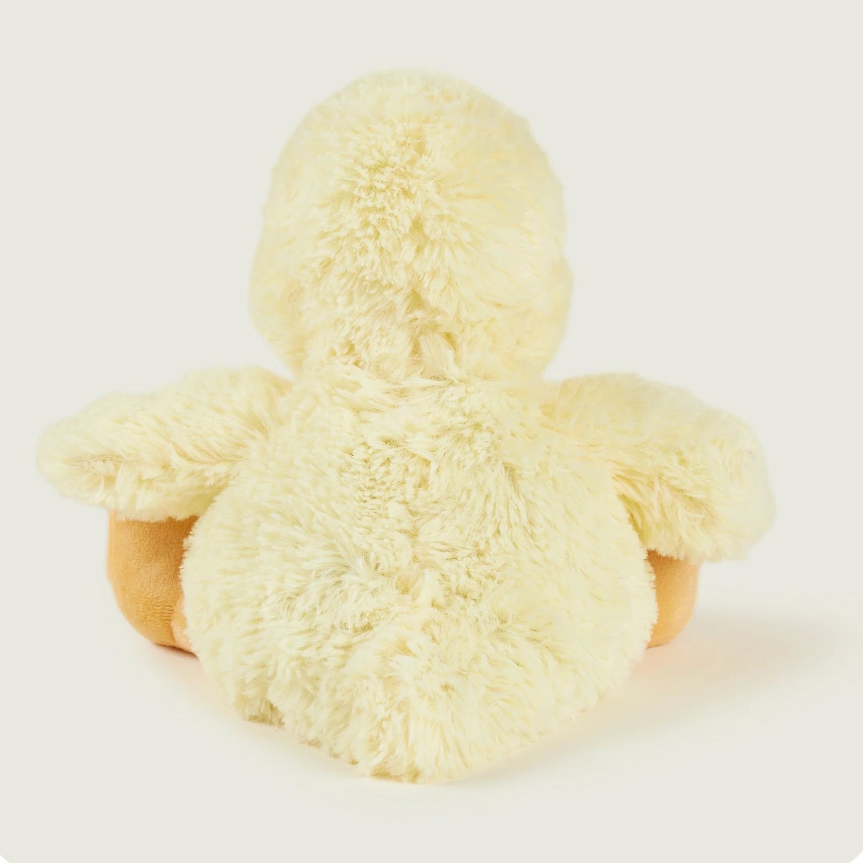 Yellow plush toy on a white background