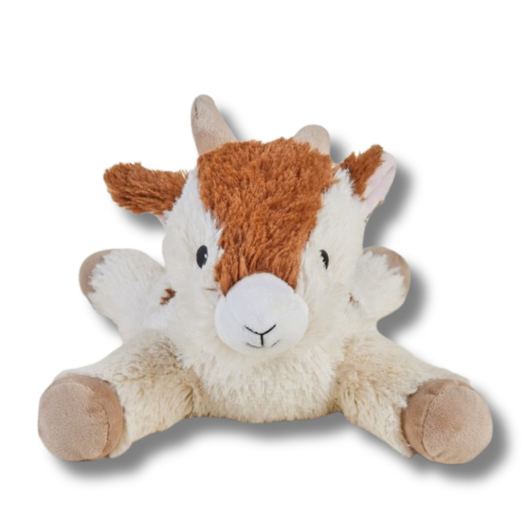 Plush toy goat on a white background