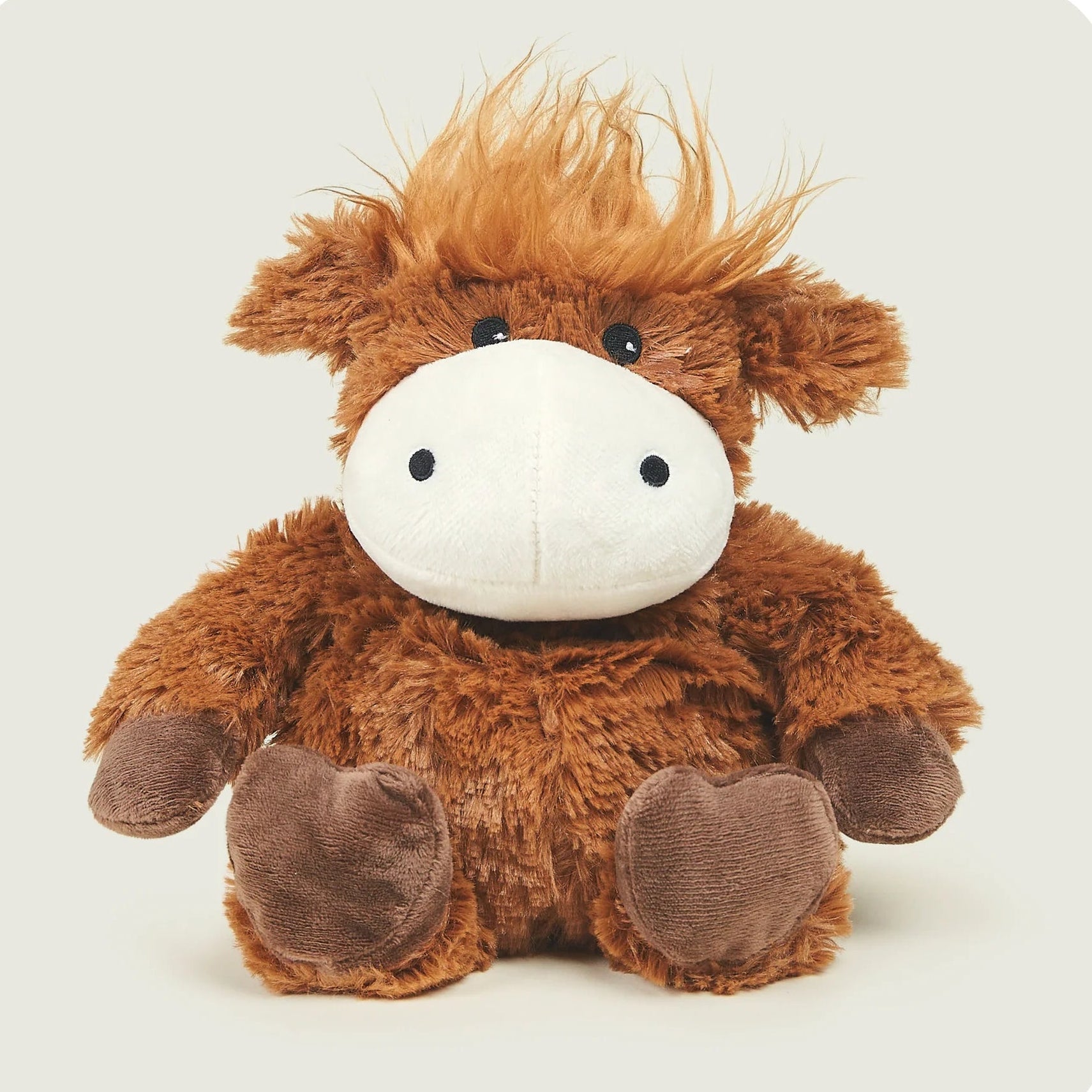 Brown plush toy with a white face on a light gray background