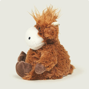 Plush horse toy with a white face on a light gray background