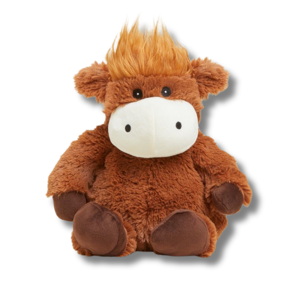 Brown plush cow toy with a white face on a white background