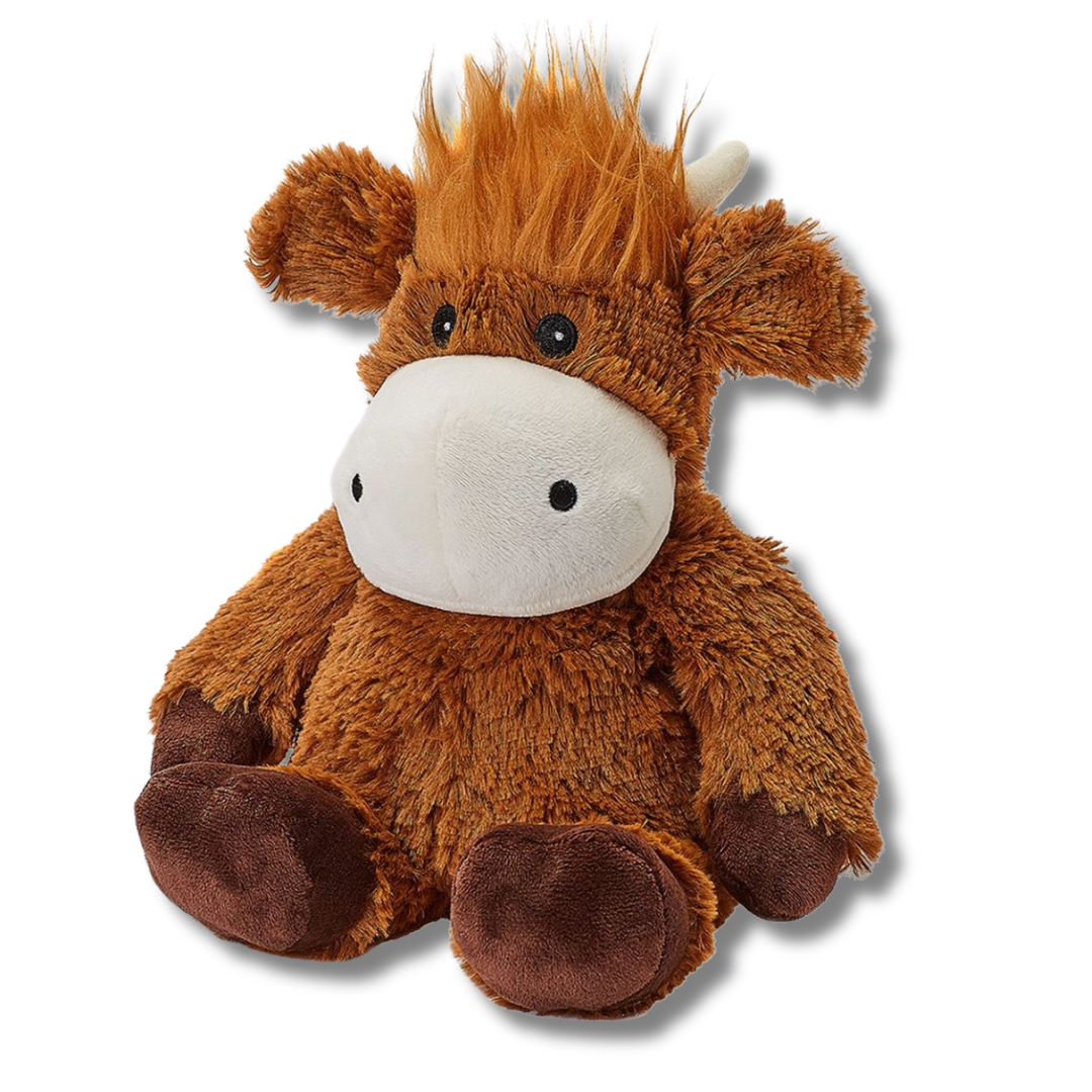 Plush toy cow with brown fur and white face on a white background
