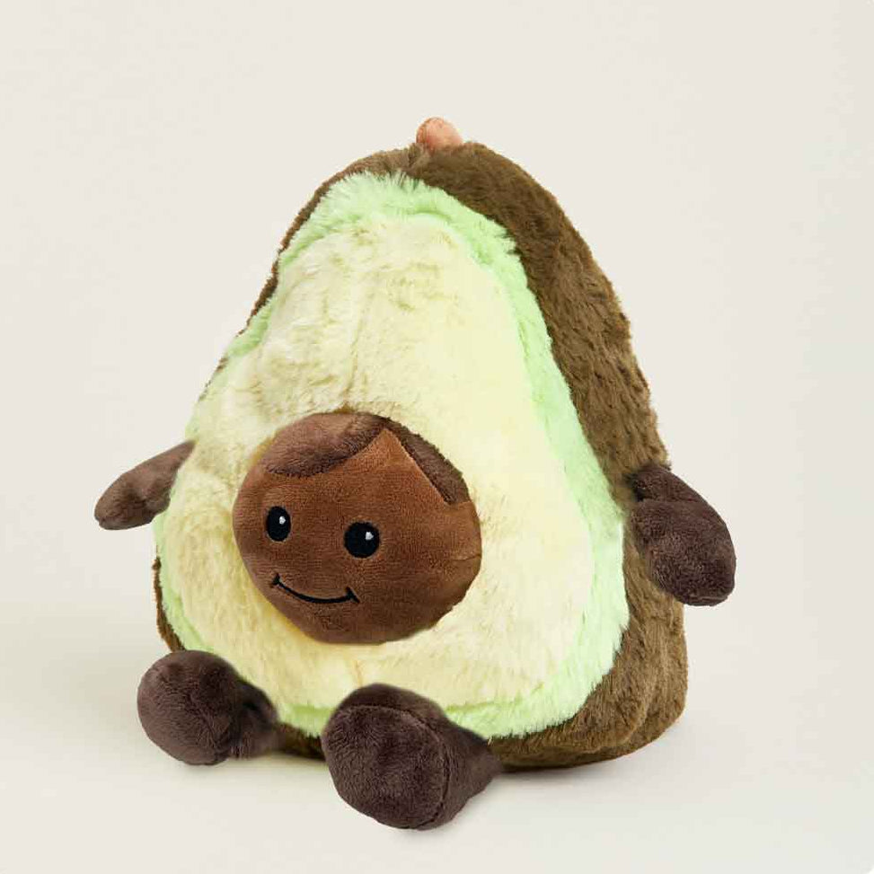 Plush toy avocado with a smiling face on a white background