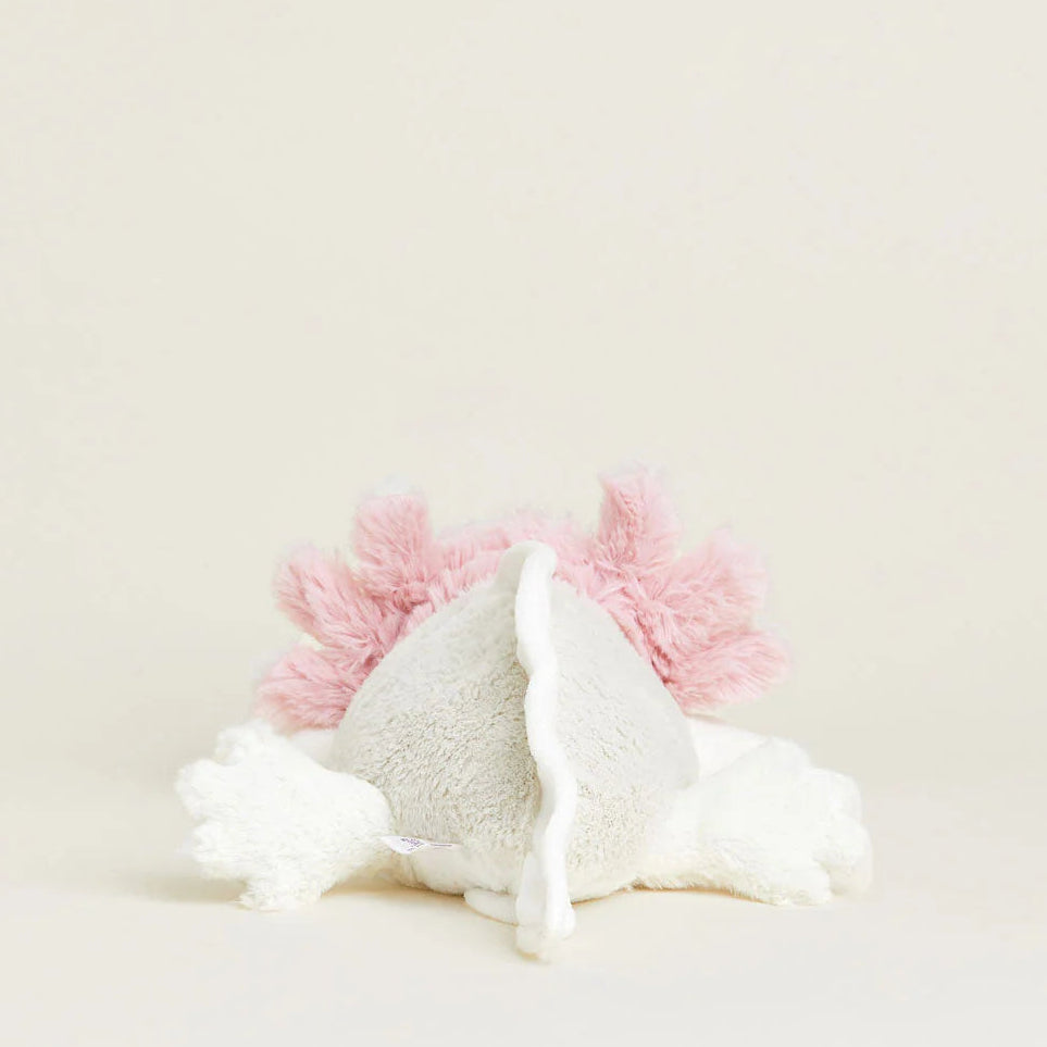 Unicorn-shaped plush toy with pink horn and mane on a light background