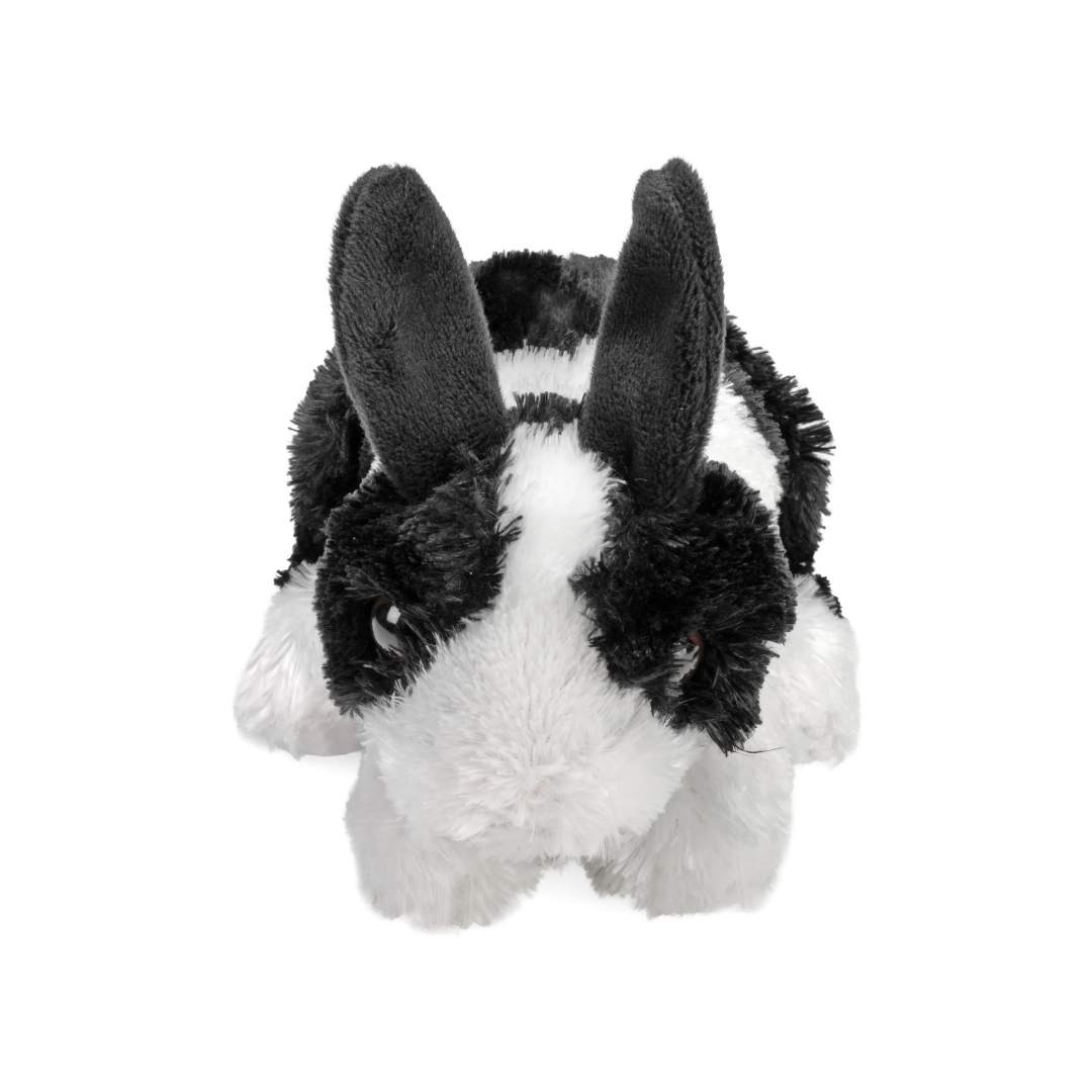 Plush toy of a black and white rabbit on a white background